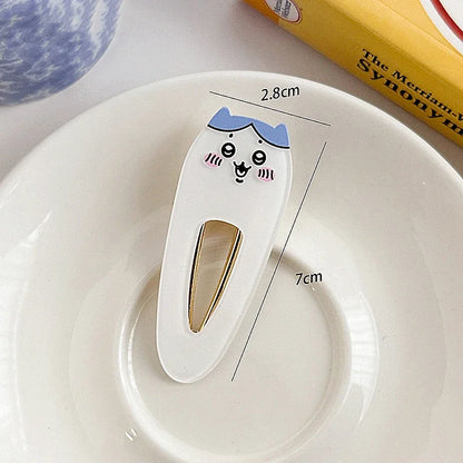 Pinces à cheveux à l'effigie de Chikaka